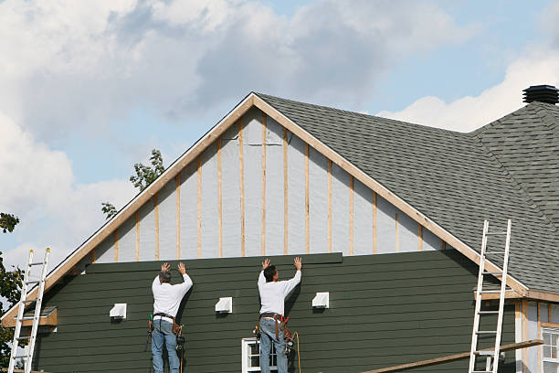 Professional Siding Installation technician working in USA